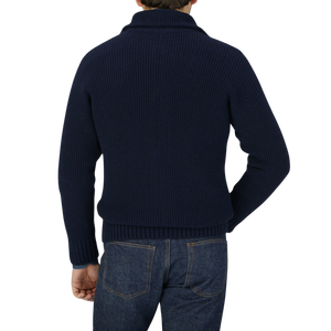 The back view of a man wearing a Gran Sasso Navy Blue Eco Cashmere Funnel Neck Cardigan.