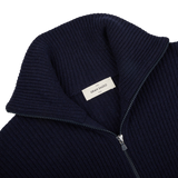 A Navy Blue Eco Cashmere Funnel Neck Cardigan by Gran Sasso in production.
