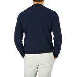 The back view of a man wearing a Gran Sasso Navy Blue Egyptian Cotton Crewneck Sweater.
