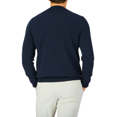 The back view of a man wearing a Gran Sasso Navy Blue Egyptian Cotton Crewneck Sweater.