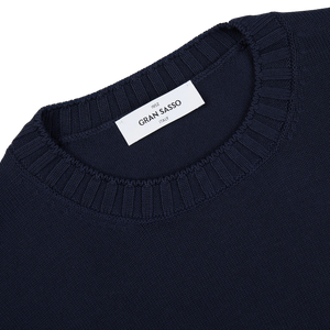 A close up of a Gran Sasso Navy Blue Egyptian Cotton Crewneck Sweater with a label on it.