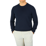 A man wearing a Navy Blue Egyptian Cotton Crewneck Sweater by Gran Sasso.