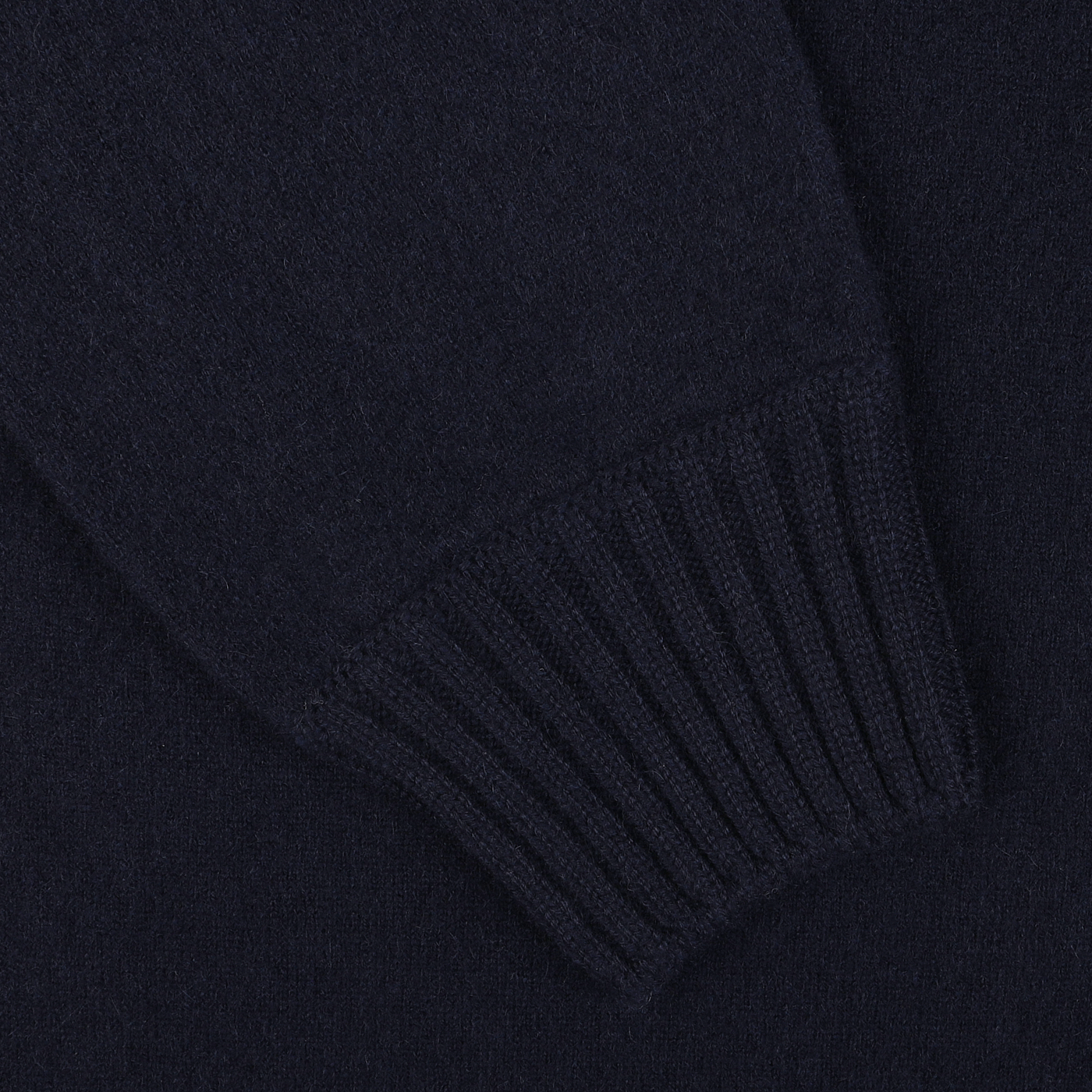 Close-up of a sleeve with ribbed cuff detail from the Navy Blue Felted Cashmere Zip Cardigan by Gran Sasso.