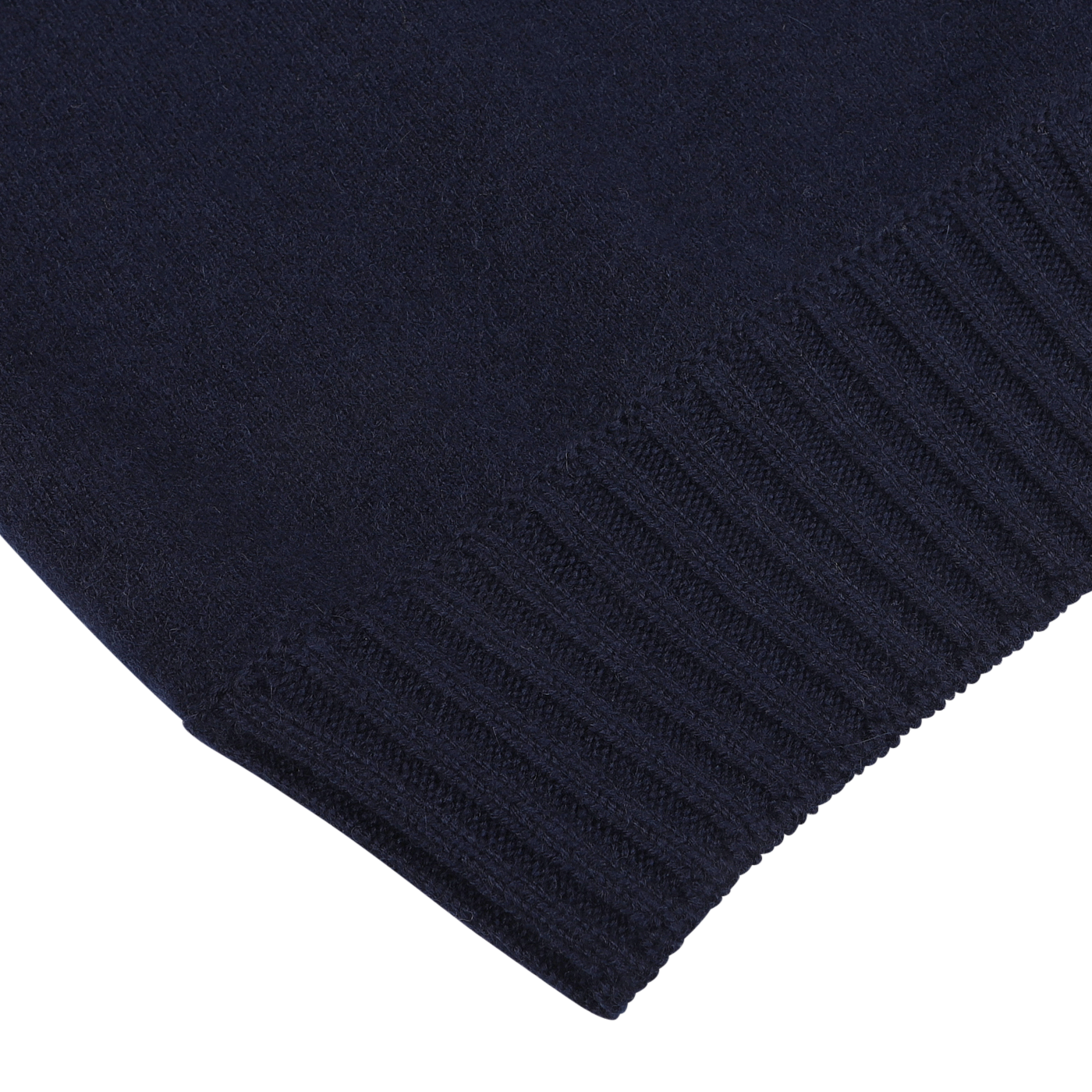 Close-up of the edge of a Navy Blue Felted Cashmere Zip Cardigan by Gran Sasso, featuring ribbed detailing at the hem, crafted from luxurious cashmere.