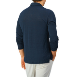 The back view of a man wearing a Gran Sasso Navy Blue Knitted Linen LS Polo Shirt.