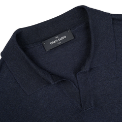 The collar of a navy Blue Knitted Silk Gran Sasso polo shirt.