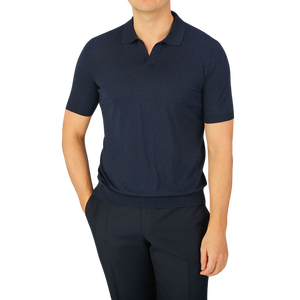 A man wearing a Gran Sasso Navy Blue Knitted Silk Polo Shirt.