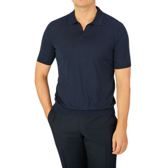 A man wearing a Gran Sasso Navy Blue Knitted Silk Polo Shirt.