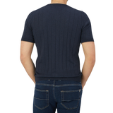The back view of a man wearing a Gran Sasso Navy Blue Knitted Silk T-Shirt.
