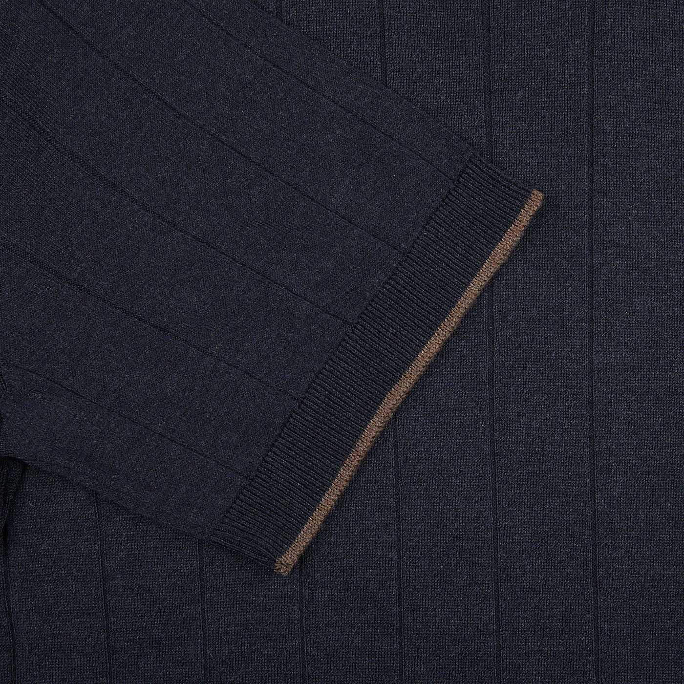 A close up of a Gran Sasso navy blue knitted silk t-shirt with brown trim.