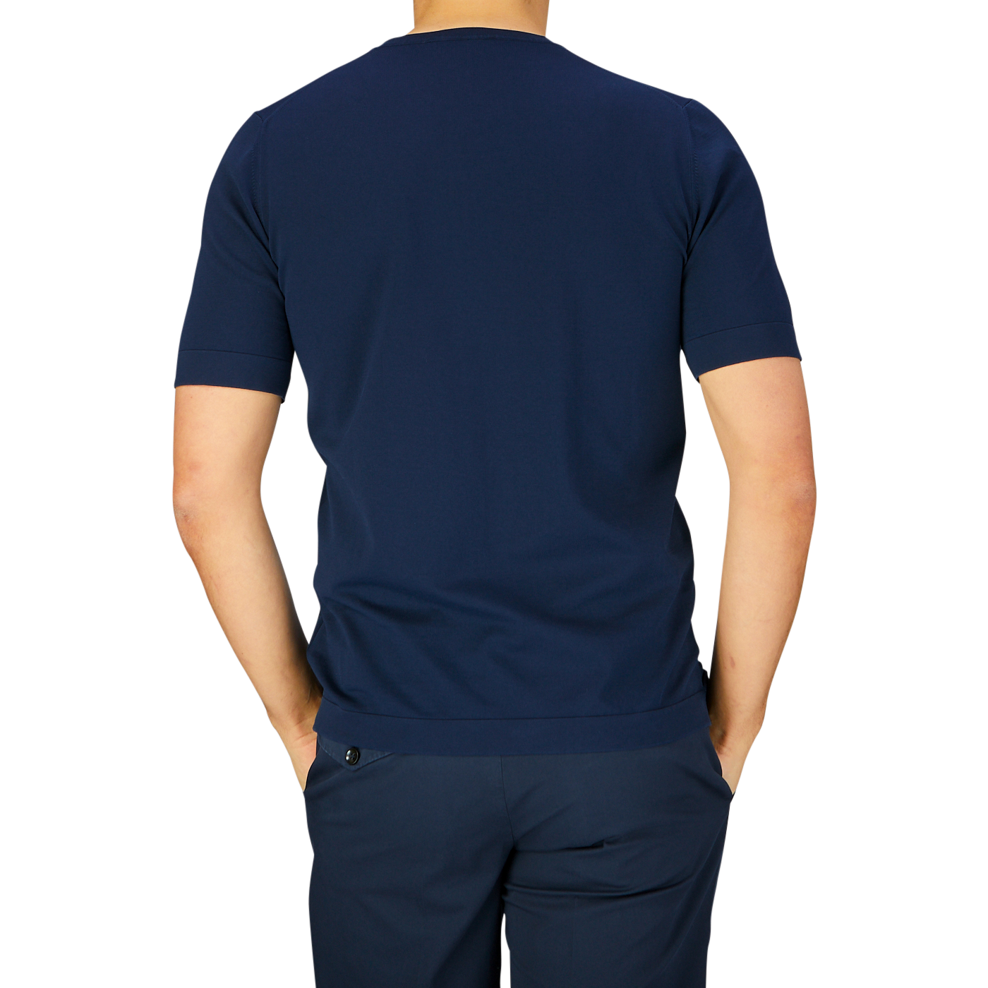 Man wearing a Gran Sasso navy blue organic cotton t-shirt and pants, viewed from the back.
