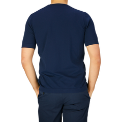 Man wearing a Gran Sasso navy blue organic cotton t-shirt and pants, viewed from the back.