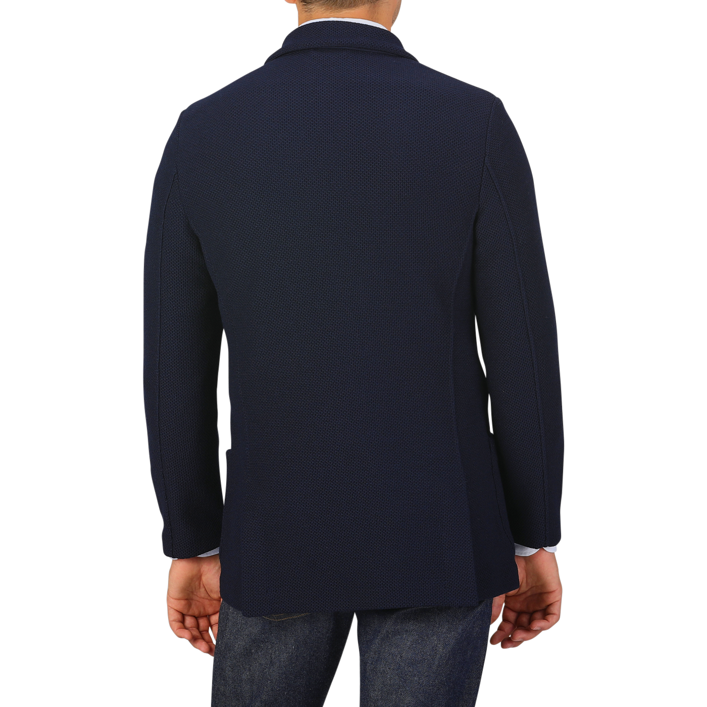 Rear view of a person wearing the Navy Blue Virgin Wool Sartorial Jacket by Gran Sasso, paired with jeans against a plain background.