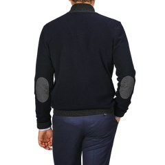 A person wearing a Gran Sasso Navy Blue Wool Cashmere Zip Cardigan, potentially layered over premium knitwear, is seen from the back against a plain background.