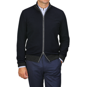 A person stands casually with one hand in their pocket, wearing Gran Sasso's Navy Blue Wool Cashmere Zip Cardigan over a striped shirt and navy pants.