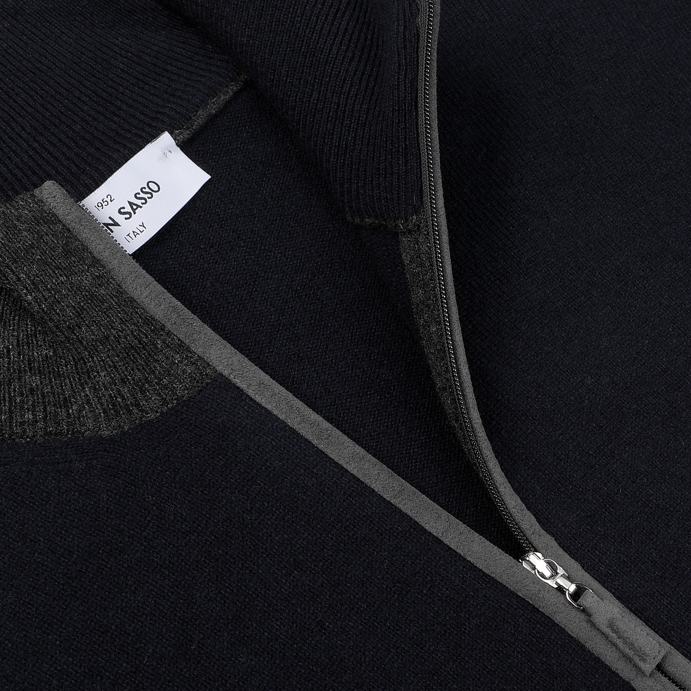 Close-up of a Navy Blue Wool Cashmere Zip Cardigan by Gran Sasso, highlighting its luxurious knitwear with a visible label on the collar.