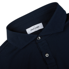 Close-up of a navy Gran Sasso popover cotton jersey shirt collar with a 'Gran Sasso' brand label.