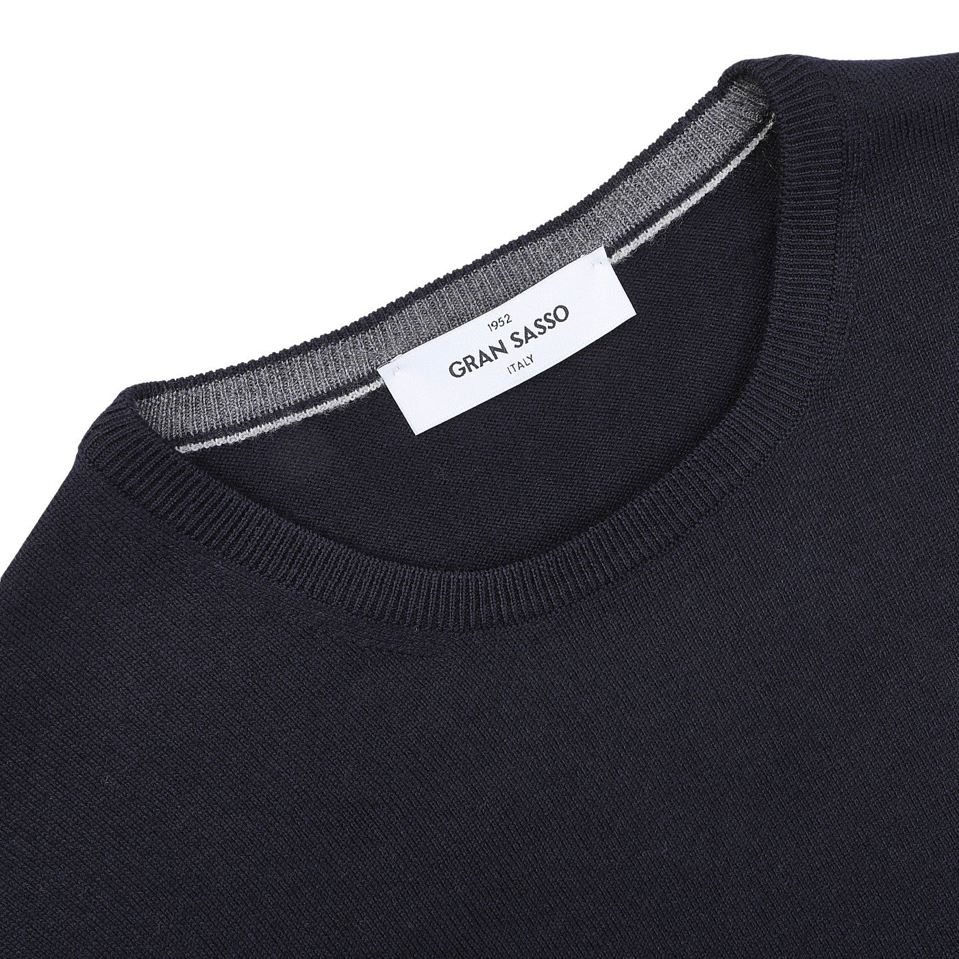 Close-up of a navy Gran Sasso sweater with the label inside the neck, highlighting its fine merino quality for added warmth.