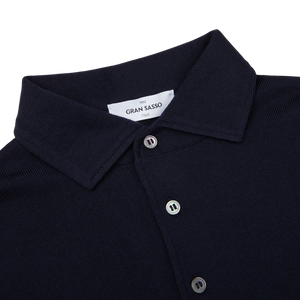 A navy Merino Wool one-piece collar polo shirt, made by Gran Sasso.