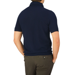 The back view of a man wearing a Gran Sasso Navy Fresh Cotton Mesh Polo Shirt.