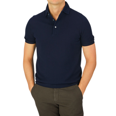 A man wearing a Navy Fresh Cotton Mesh Polo Shirt by Gran Sasso.