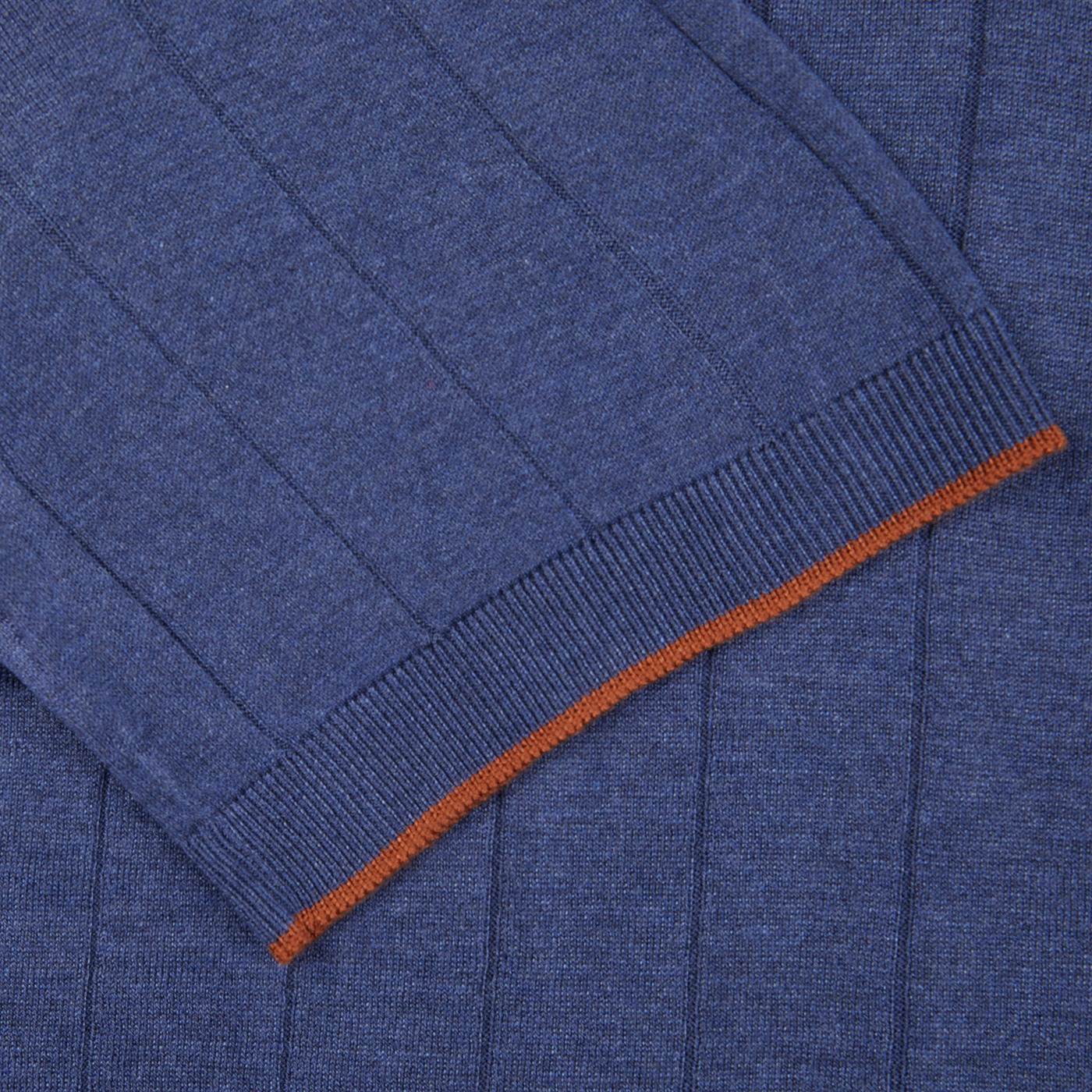 A close up of a Gran Sasso dark blue knitted silk zip polo shirt with orange trim.