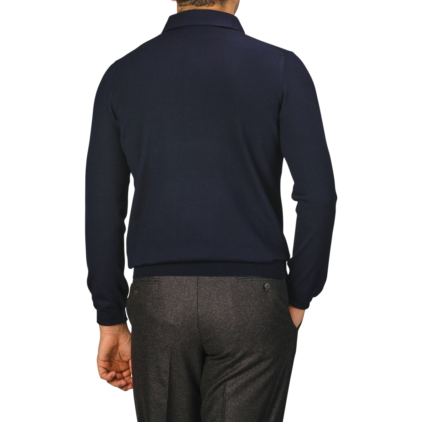 A person wearing a Navy Merino Wool One-Piece Collar Polo Shirt by Gran Sasso and gray pants is standing with their back to the camera.