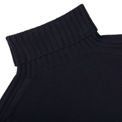 Close-up of the Navy Rain Wool Rib Roll Neck by Gran Sasso, showcasing a high ribbed turtleneck collar that is both water- and stain-resistant, crafted with Zegna Baruffa rain wool.