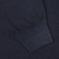 Close-up of a dark blue knit fabric with a ribbed cuff, capturing the vintage feel of the Navy Vintage Merino Wool Zip Cardigan by Gran Sasso.