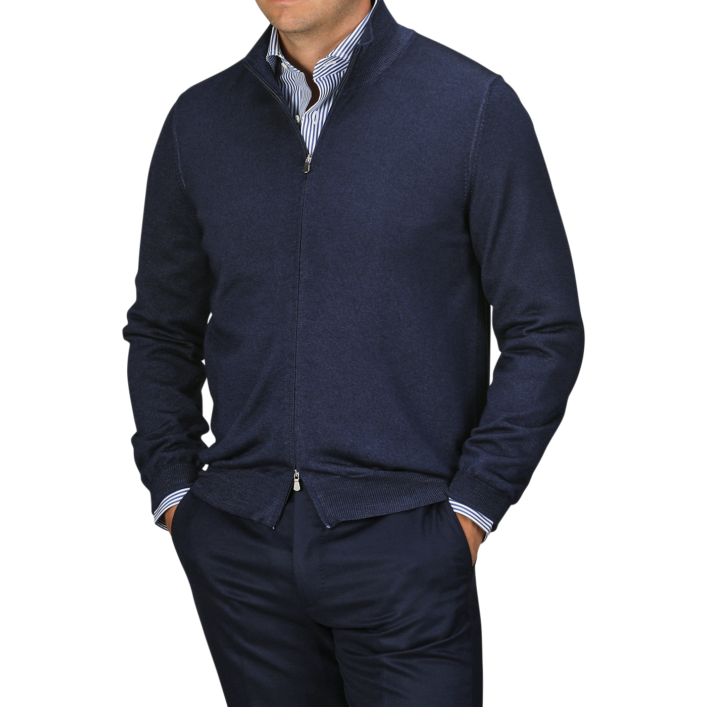 A person dressed in a Navy Vintage Merino Wool Zip Cardigan from Gran Sasso over a blue-and-white striped shirt with navy pants, viewed from the chest down.