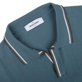 Close-up of a Gran Sasso branded Ocean Blue Fresh Cotton Polo Shirt collar with white and brown stripes detailing.