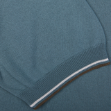 Close-up of a Gran Sasso Ocean Blue Fresh Cotton Polo Shirt with ribbed hem showcasing white and brown striping.