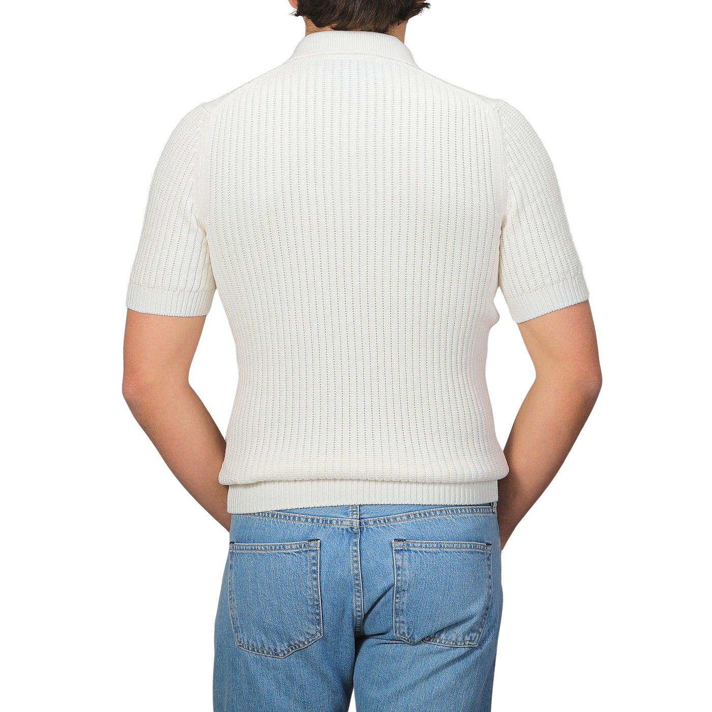 A person in an Off-White Organic Cotton Polo Shirt by Gran Sasso and blue jeans is facing away from the camera.