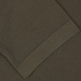 Close-up of a Gran Sasso Olive Green Organic Cotton T-shirt with visible texture and stitching.