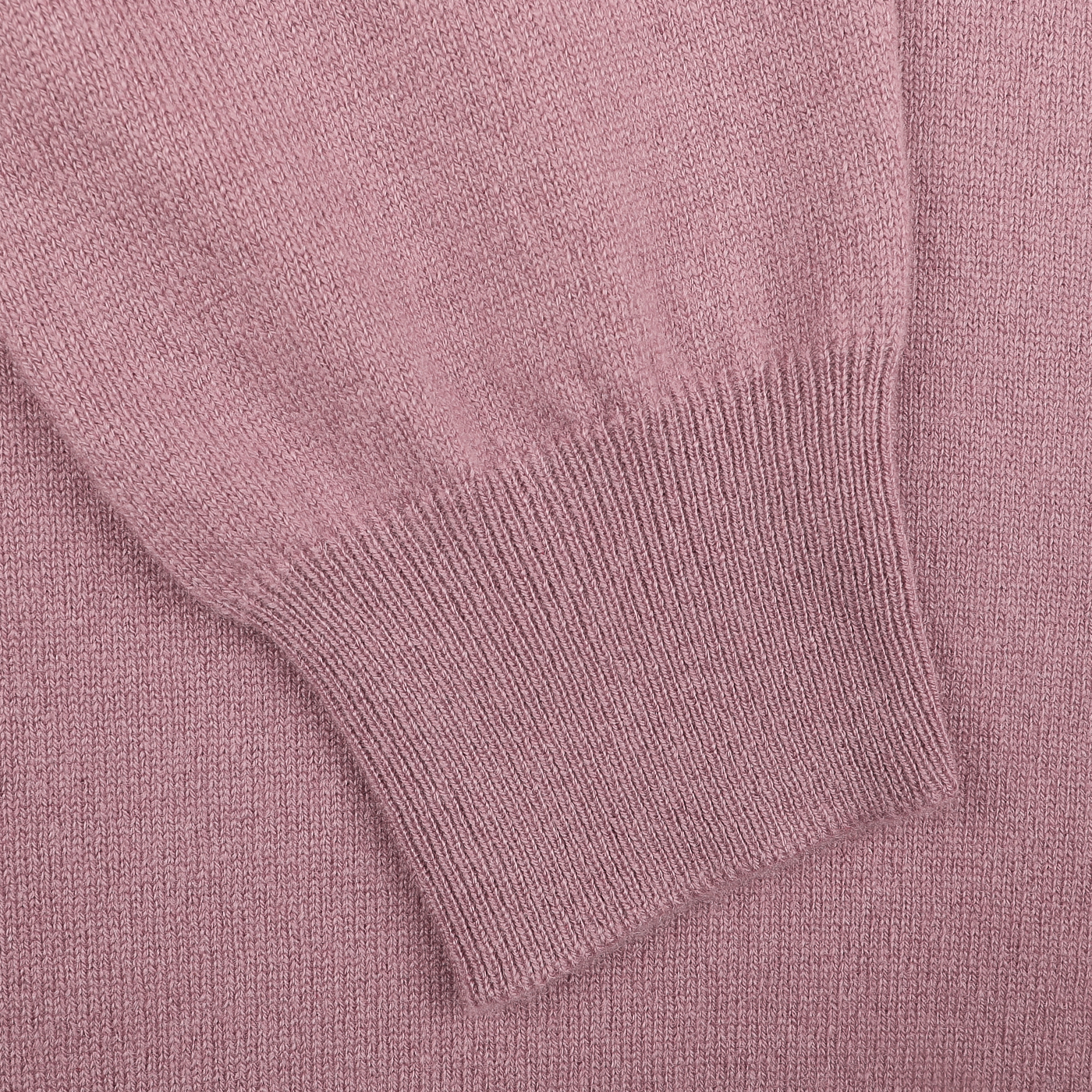 Close-up of the pale pink cashmere crewneck sweater cuff, highlighting the intricate ribbing texture characteristic of Gran Sasso's sustainable knitwear.