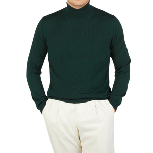 A man wearing a Gran Sasso Petrol Green Extra Fine Merino Roll Neck turtleneck sweater.