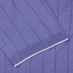 A close up of a Gran Sasso purple knitted silk polo shirt.