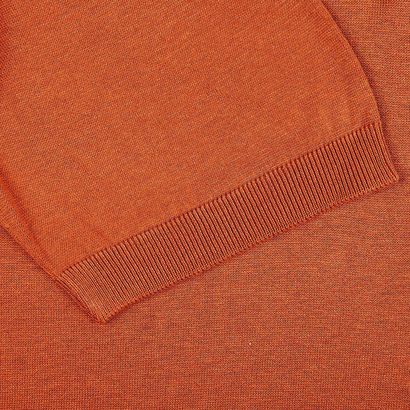 A close up of a Gran Sasso Rust Orange Knitted Silk Polo Shirt.