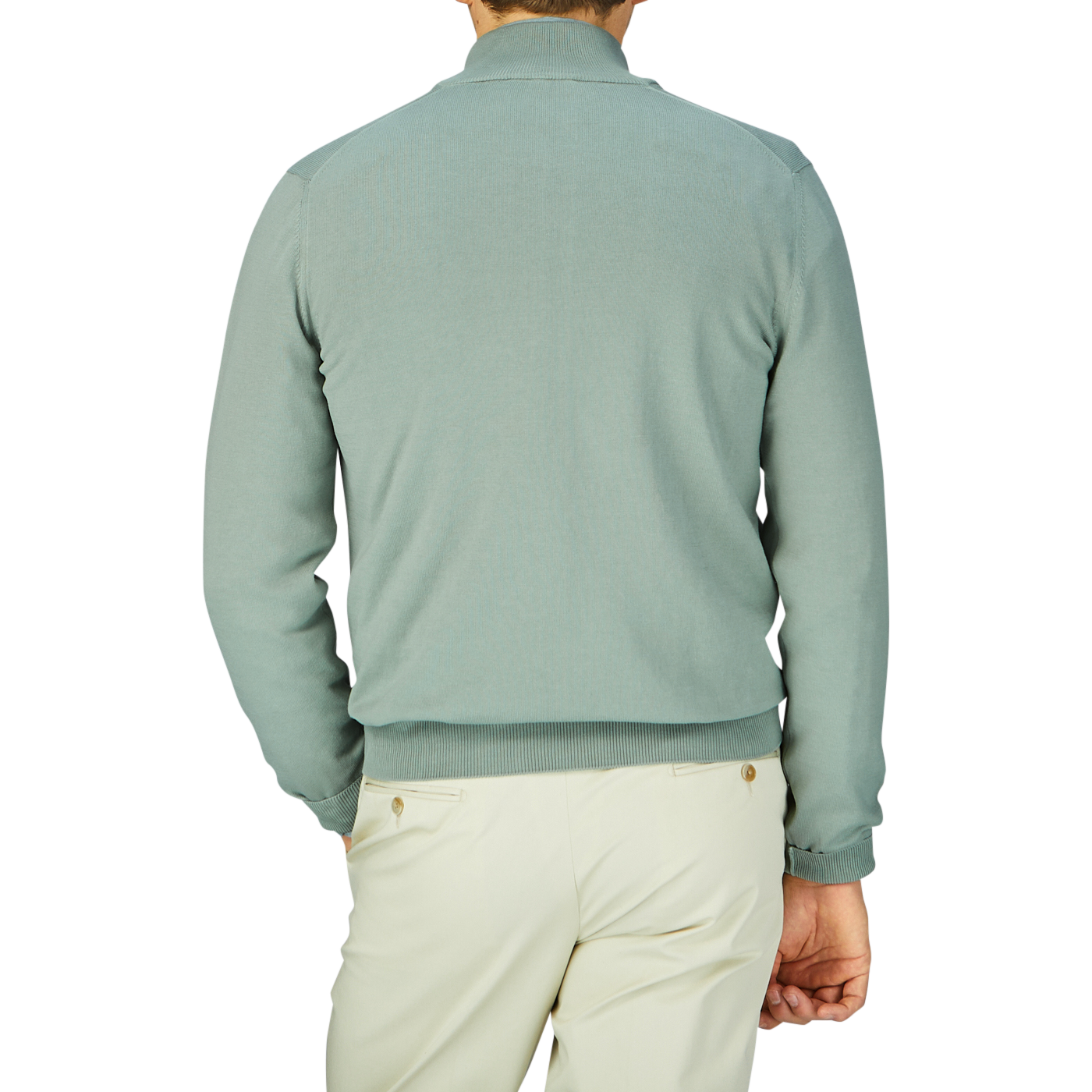 A man seen from behind wearing a slim fit, sage green Gran Sasso Egyptian Cotton 1/4 Zip sweater and light-colored pants.
