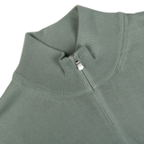 Close-up of a Sage Green Egyptian Cotton 1/4 Zip Sweater by Gran Sasso with a half-zip collar.