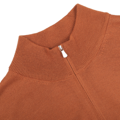 Close-up of a Gran Sasso zip cardigan in sienna brown, expertly crafted from extrafine merino wool, showcasing a partially closed visible zipper at the collar.