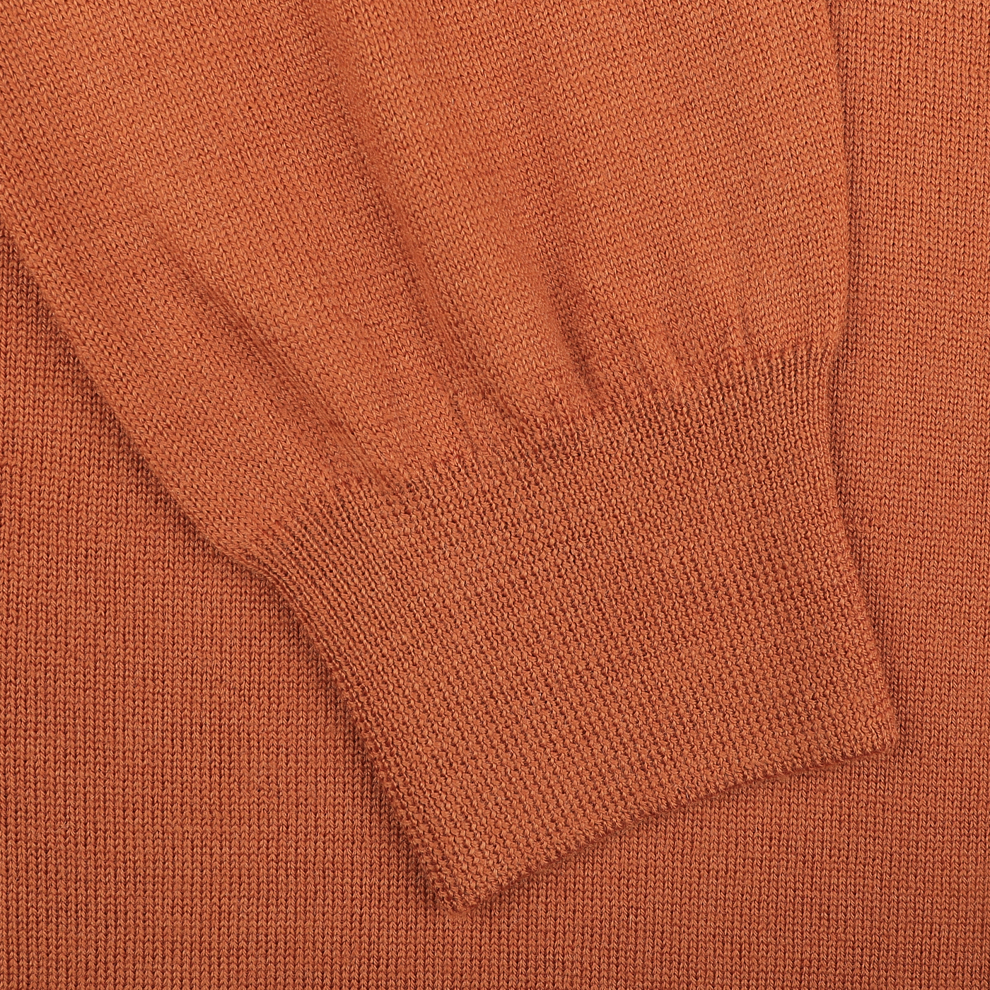 Close-up of a sleeve from the Sienna Brown Zip Cardigan by Gran Sasso, crafted from luxurious extrafine merino wool and highlighting a ribbed cuff detail.