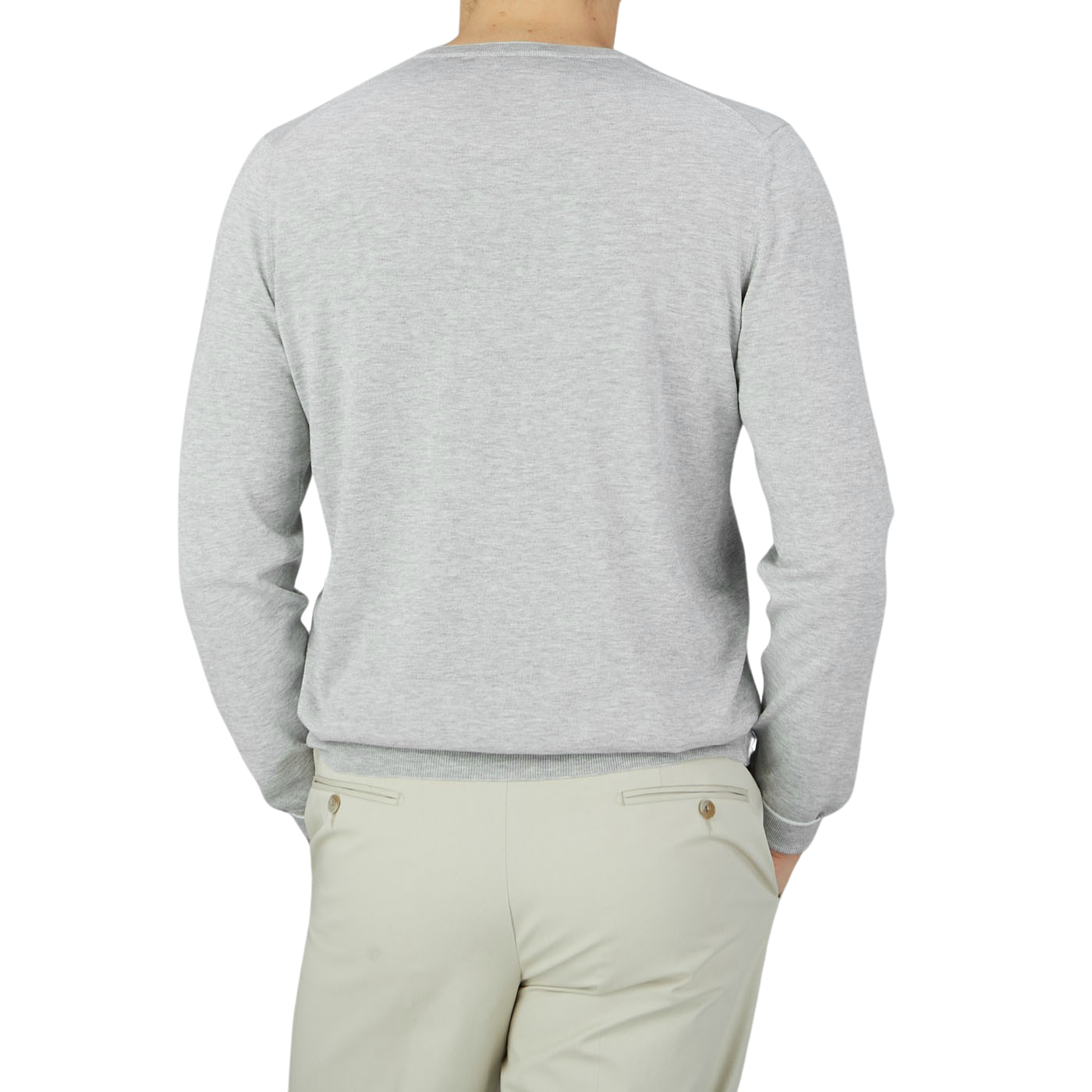 The back view of a man wearing a Gran Sasso Silver Grey Silk Cotton Crewneck Sweater and tan pants, perfect for the summer version.