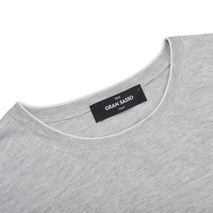 A Silver Grey Silk Cotton Crewneck Sweater by Gran Sasso with a label on it.