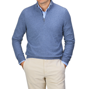 A person wearing the Gran Sasso Sky Blue Cashmere 1/4 Zip Sweater over a light blue shirt and beige pants, standing with hands in pockets.