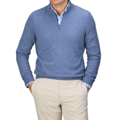 A person wearing the Gran Sasso Sky Blue Cashmere 1/4 Zip Sweater over a light blue shirt and beige pants, standing with hands in pockets.