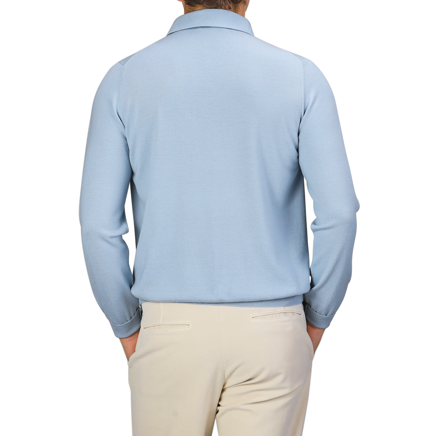 A person wearing a Sky Blue Merino Wool One-Piece Collar Polo Shirt from Gran Sasso and beige pants, viewed from the back.