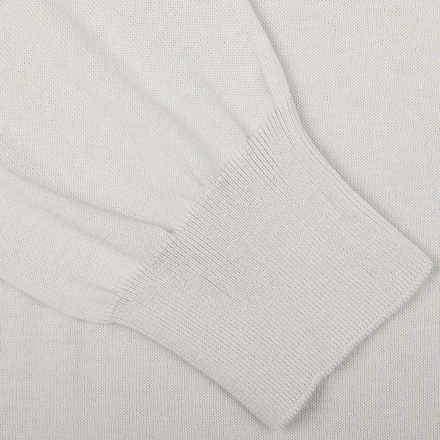 Close-up of a Gran Sasso Taupe Beige Organic Cotton LS Polo Shirt with ribbed cuff detail.
