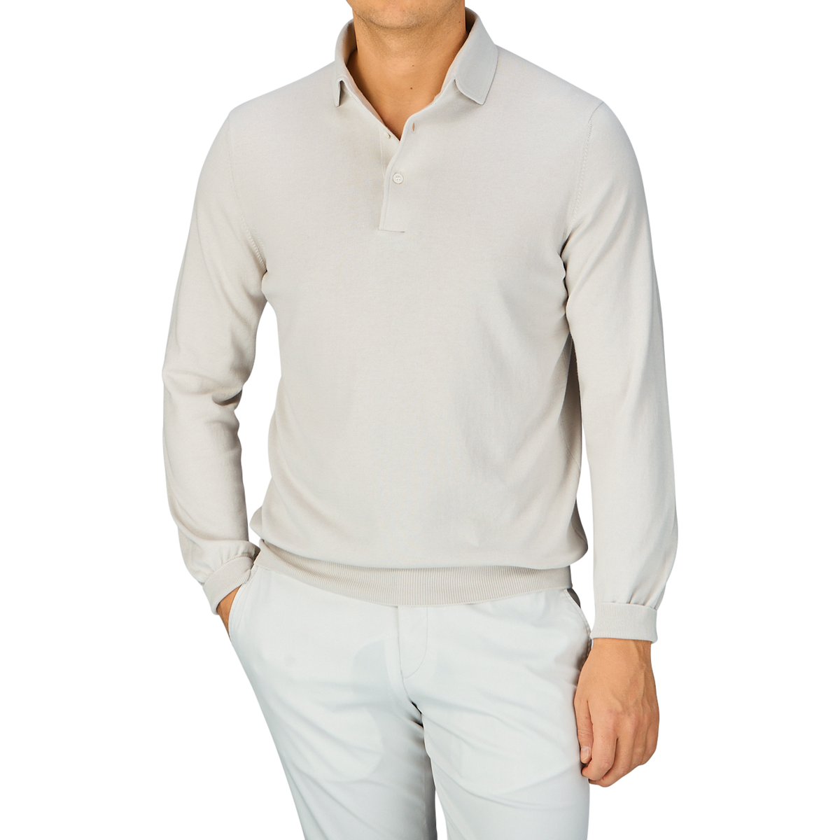 Man wearing a Taupe Beige Organic Cotton LS Polo Shirt by Gran Sasso and white pants against a blue background.