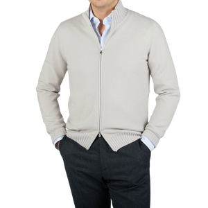 A man wearing a Gran Sasso Taupe Felted Cashmere Zip Cardigan and pants.